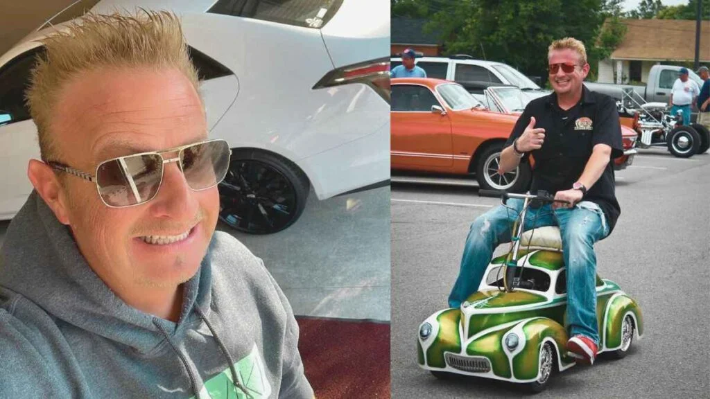 Rob 'The Rabbit' Pitts sitting on a small car