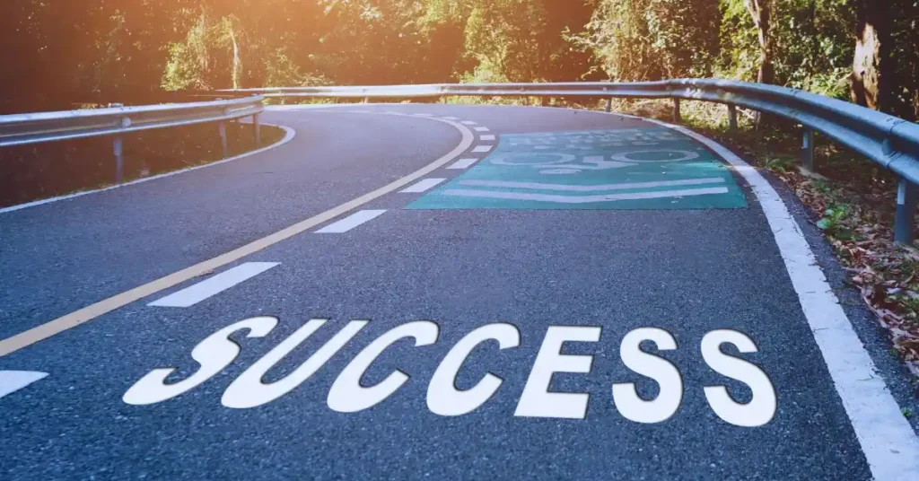 7 Powerful Habits for Success: Life-Changing Journey on the Right Path in the USA Winding road with "SUCCESS" written on it, symbolizing life-changing habits for achieving Habits for Success in the USA.