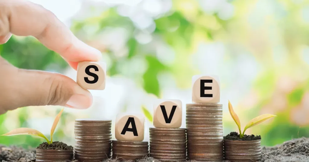 The Right Way to Save Money: $10,000 a Year in the USA The Right Way to Save Money - Hand placing a block with the letter 'S' on stacks of coins labeled 'SAVE' with sprouting plants symbolizing financial growth.