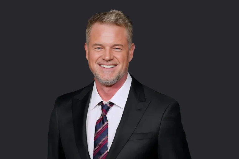 Eric Dane - Triumphs, Trials & His Ongoing Legacy 2 Eric Dane smiling in a black suit with striped tie, representing his USA entertainment legacy of inspiring triumphs and tough trials.