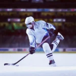 Ice hockey player taking a powerful shot during the 2026 Winter Olympics ice hockey tournament