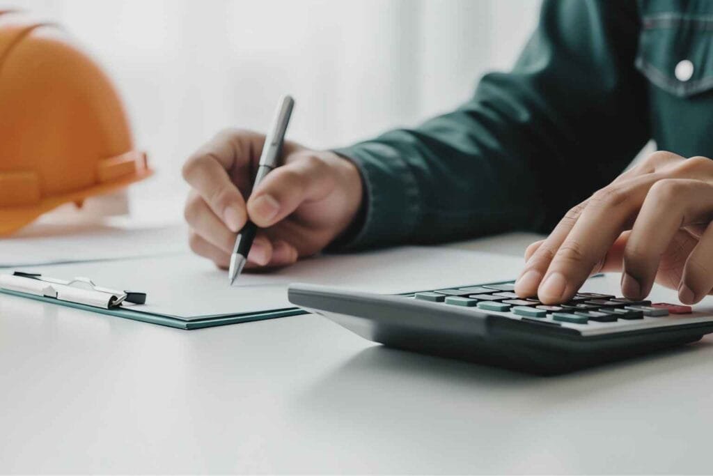 Calculator for Inflation Opens: Fed Tracks Price Surges: Analyst using calculator to review inflation data and economic cost trends