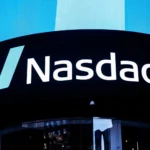 Nasdaq Composite index logo displayed at market site, representing tech stock market performance.