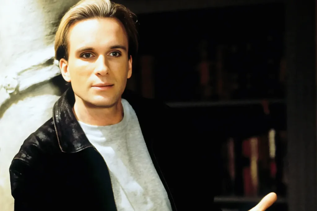 Peter Greene Portrait (1996) Portrait of Peter Greene in 1996 wearing a black jacket and light shirt indoors.
