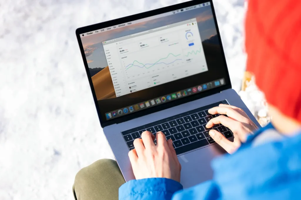 Freelancer reviewing online income dashboard on laptop while learning how to start freelancing with no experience