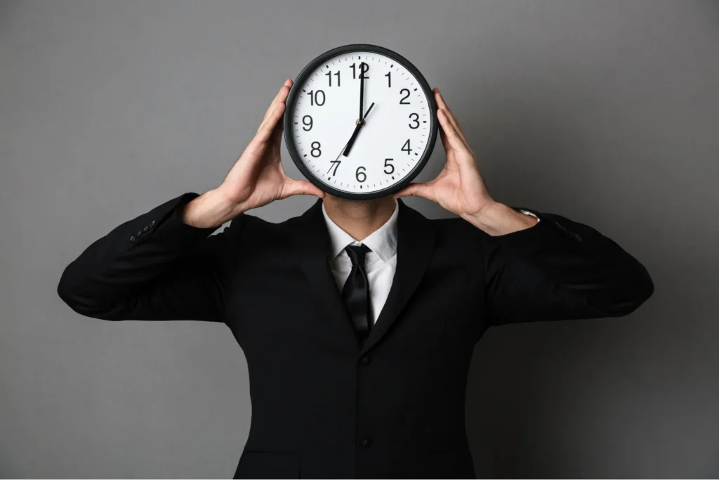 Home | RIGHWAY 10 Man holding clock instead of face showing how to manage time effectively for productivity and success