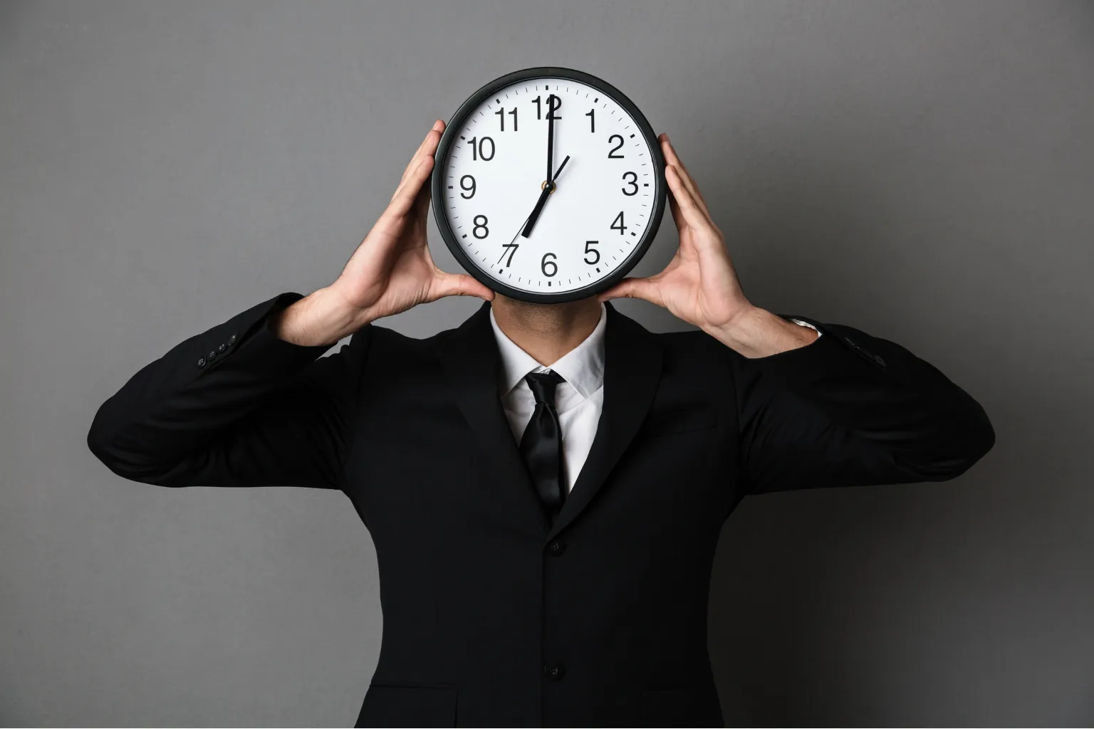 How to Manage Time Effectively - 7 Proven Strategies 1 Man holding clock instead of face showing how to manage time effectively for productivity and success