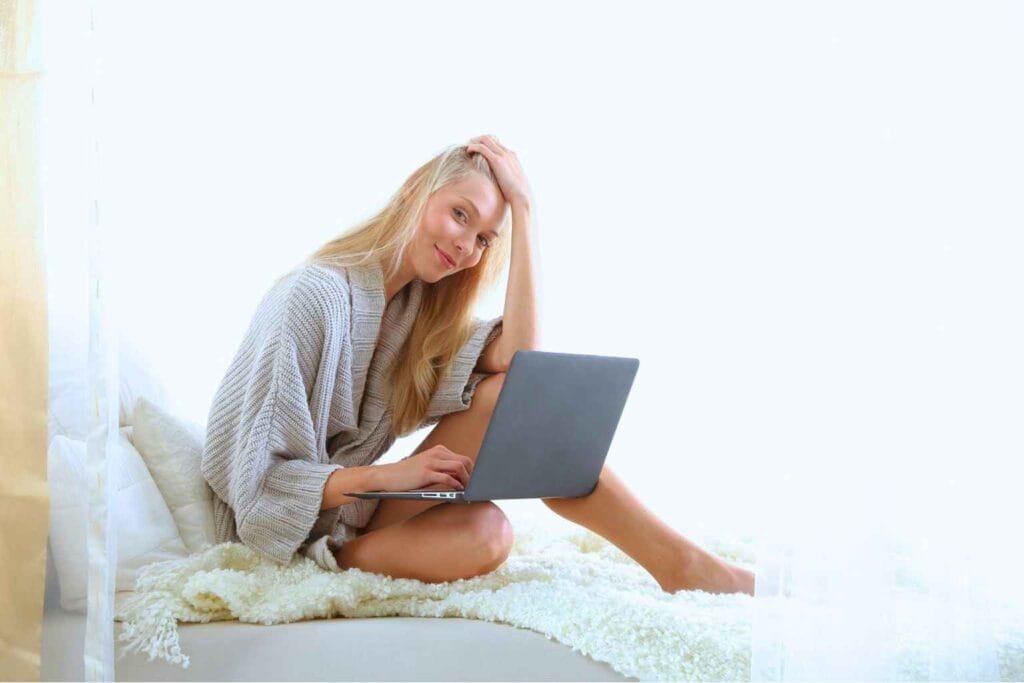 Woman working on laptop at home representing work from home jobs for female without experience and beginner remote work ideas