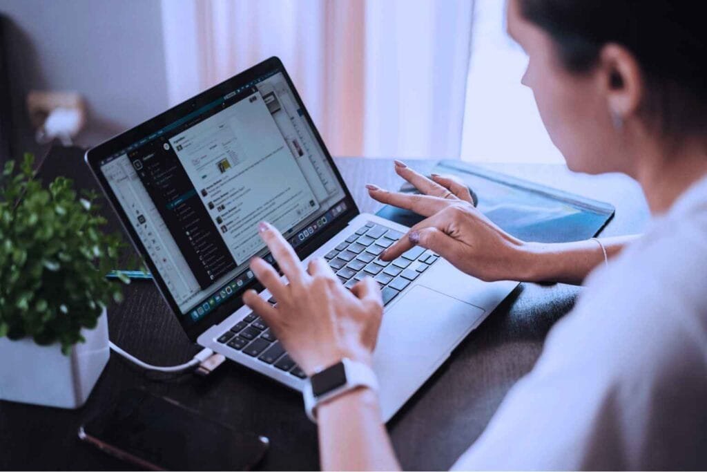 Woman working on laptop at home representing work from home jobs for female without experience and beginner remote work