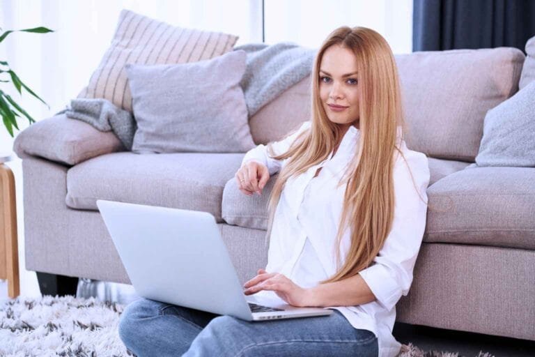Woman working on laptop at home representing work from home jobs for female without experience and beginner online income opportunities